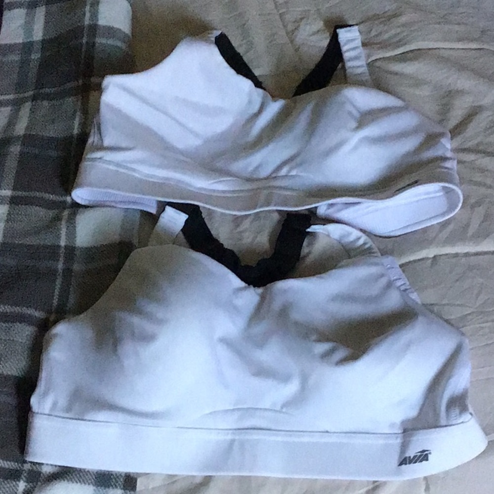Two black and white woman’s Avia sports bras.